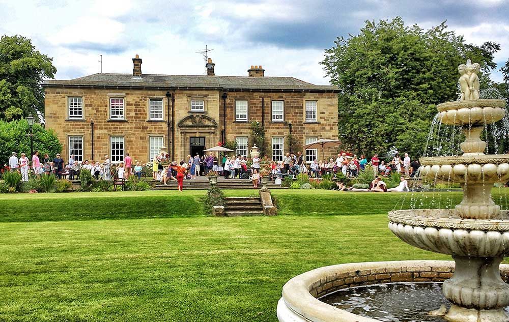 Summer fete event at Nunthorpe Hall with residents and guests on the lawn