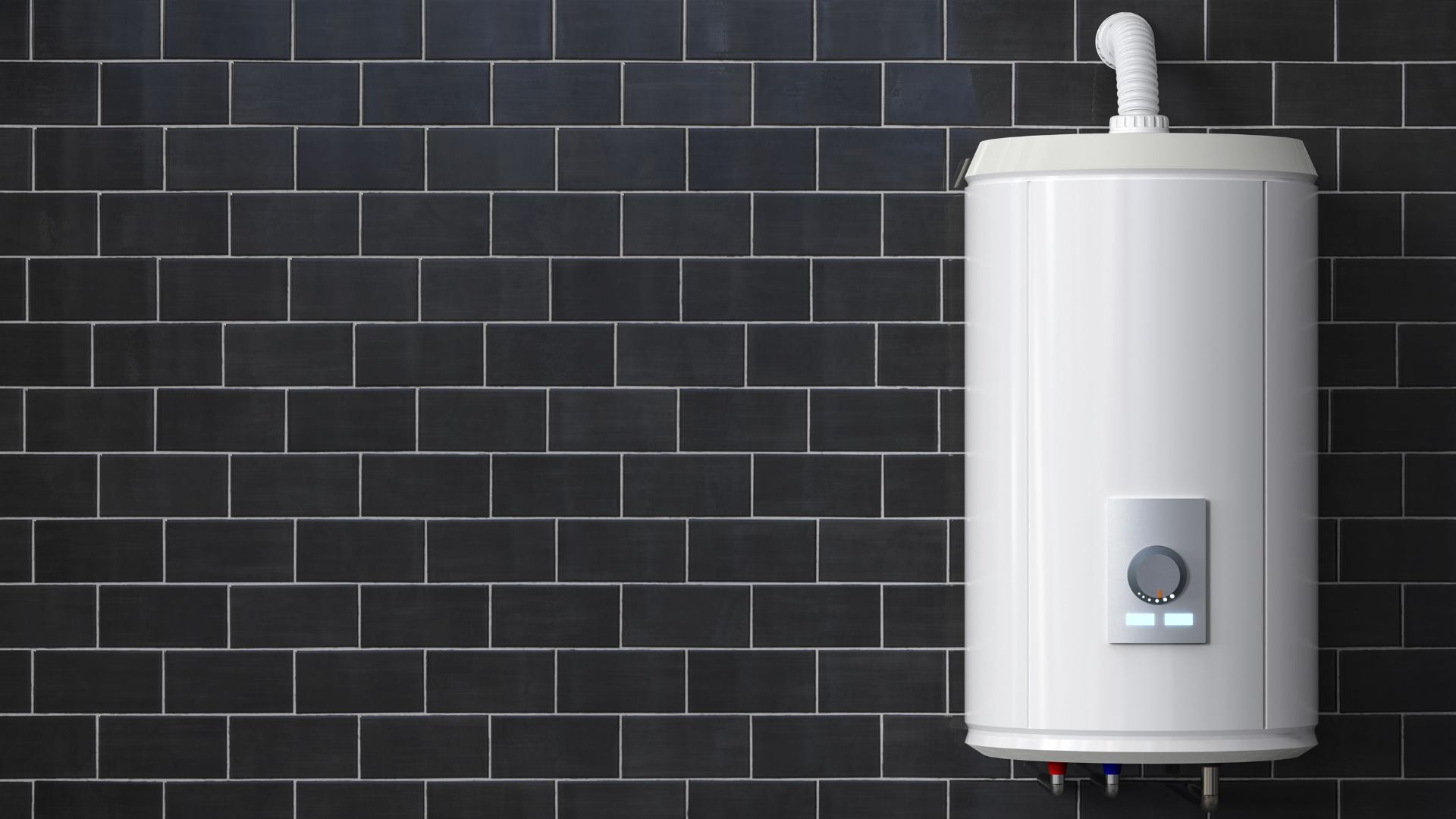 A white water heater is hanging on a black brick wall.