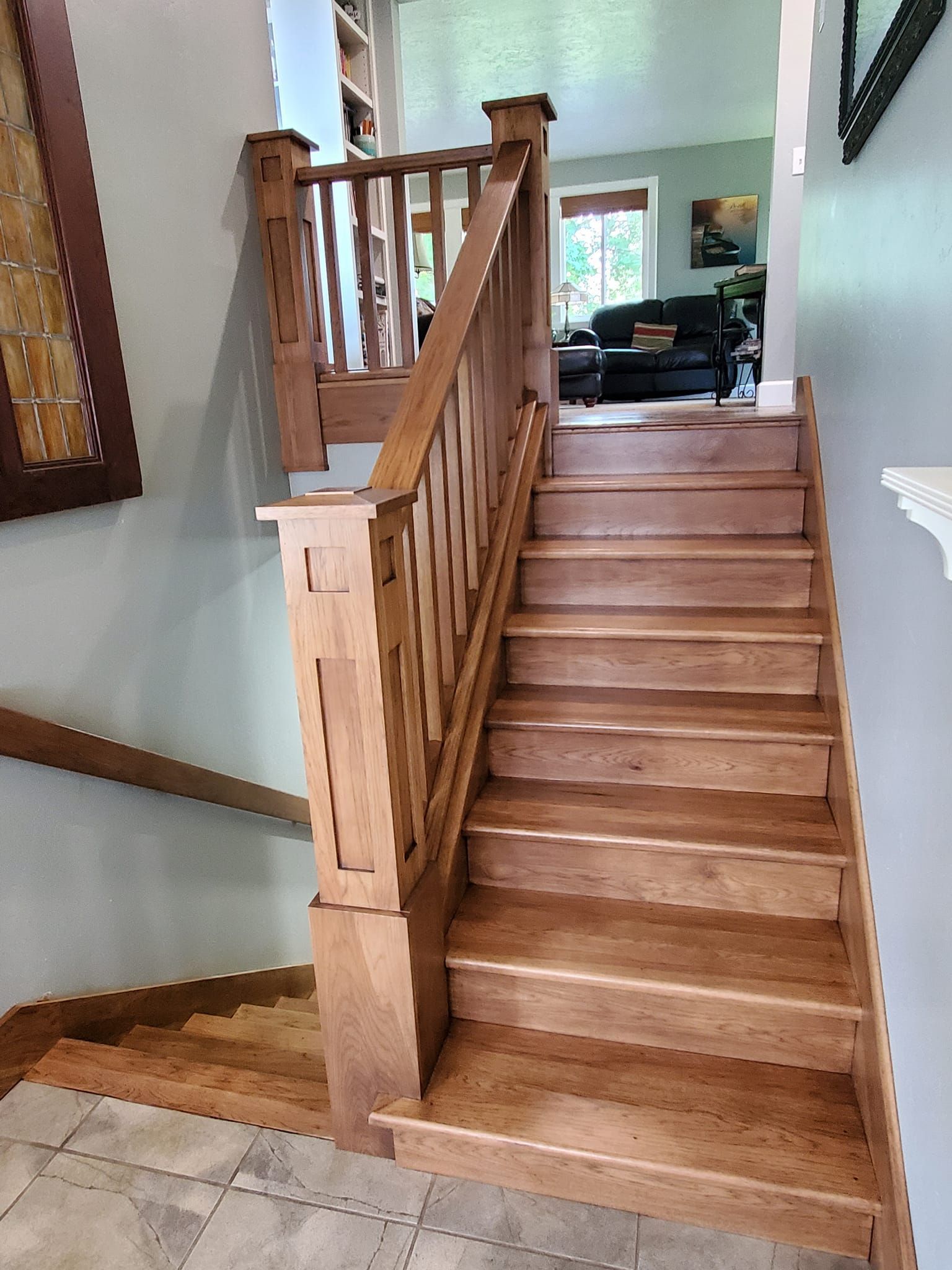A wooden staircase leading up to the second floor of a house.