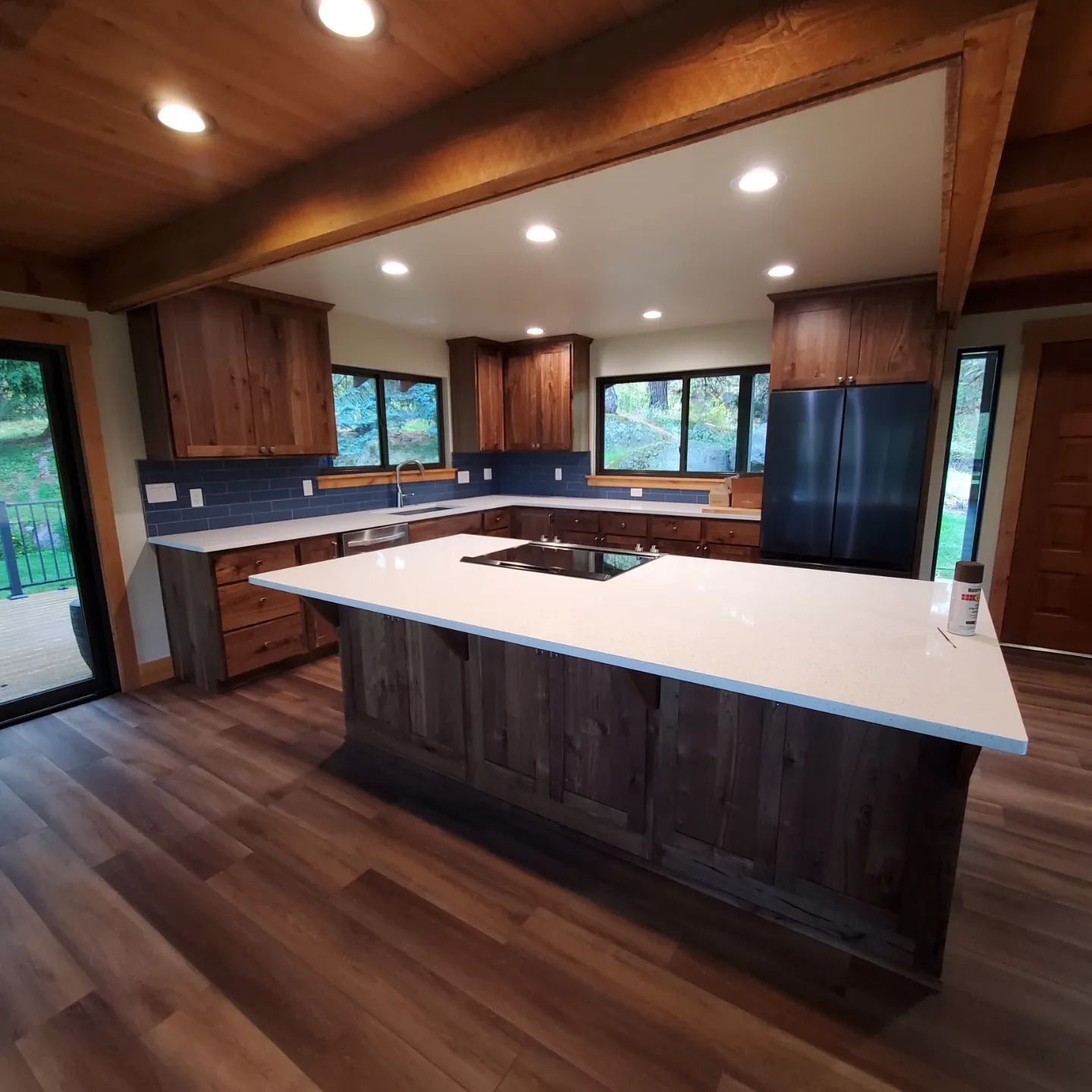 A kitchen with a large island in the middle of the room.