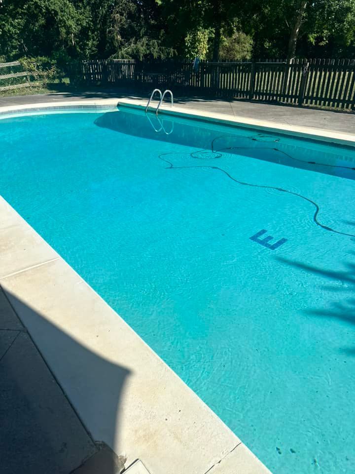 A swimming pool with the number 3 painted in the water