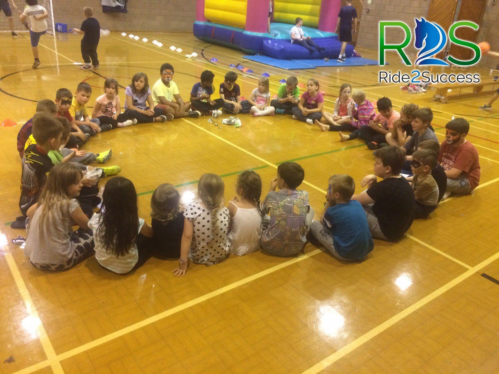 Teenage girls handing recycling brochure to man