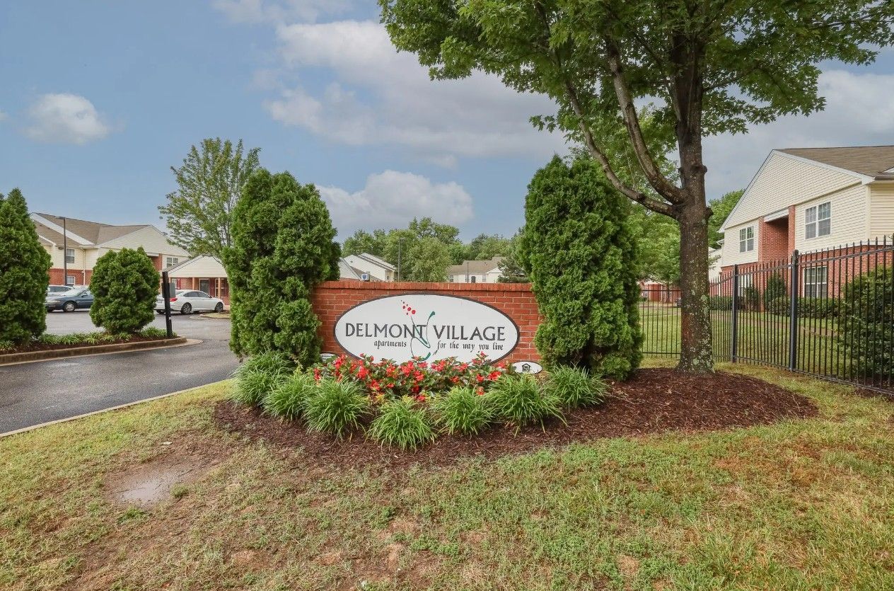 A brick sign reading 