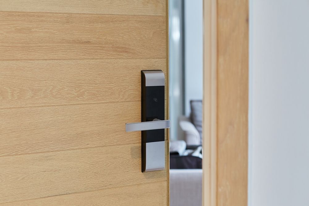 Wooden Door With Black and Silver Electronic Door Lock and Handle — Yamba Locksmiths in Yamba, NSW