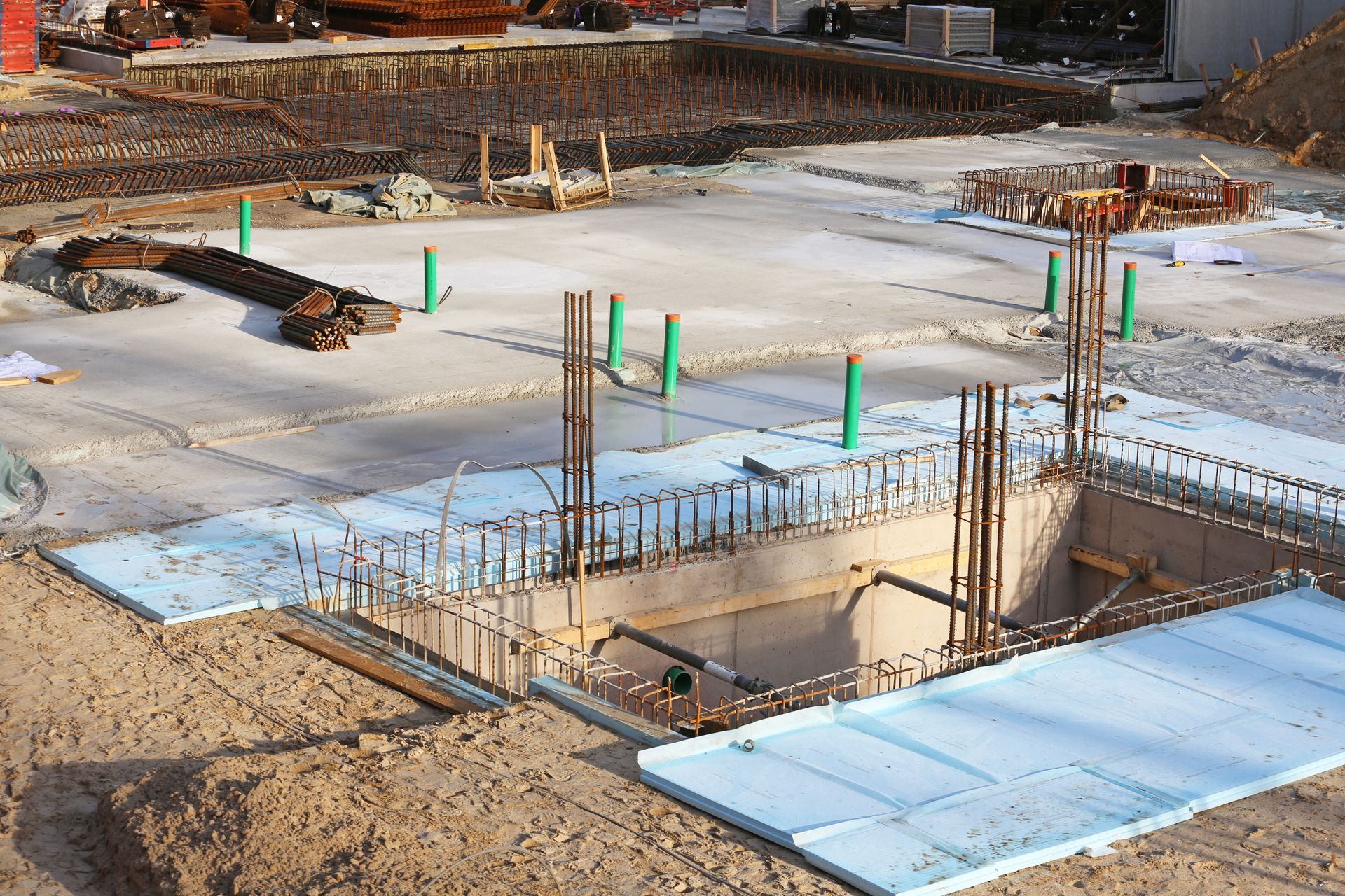 A construction site with a large hole in the middle of it.