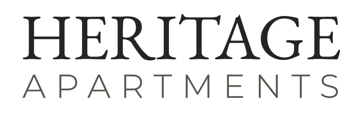 Logo for Auburn Creek Apartments in brown text.