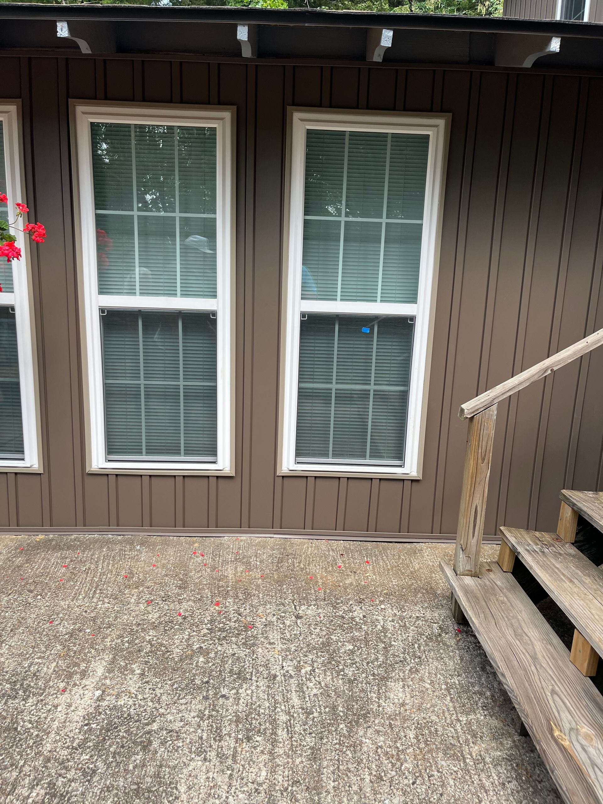 A close up of a roof with a drainpipe on it.