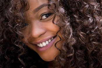 Synthetic Wigs — Woman Face with Curly Hair in Miami, FL