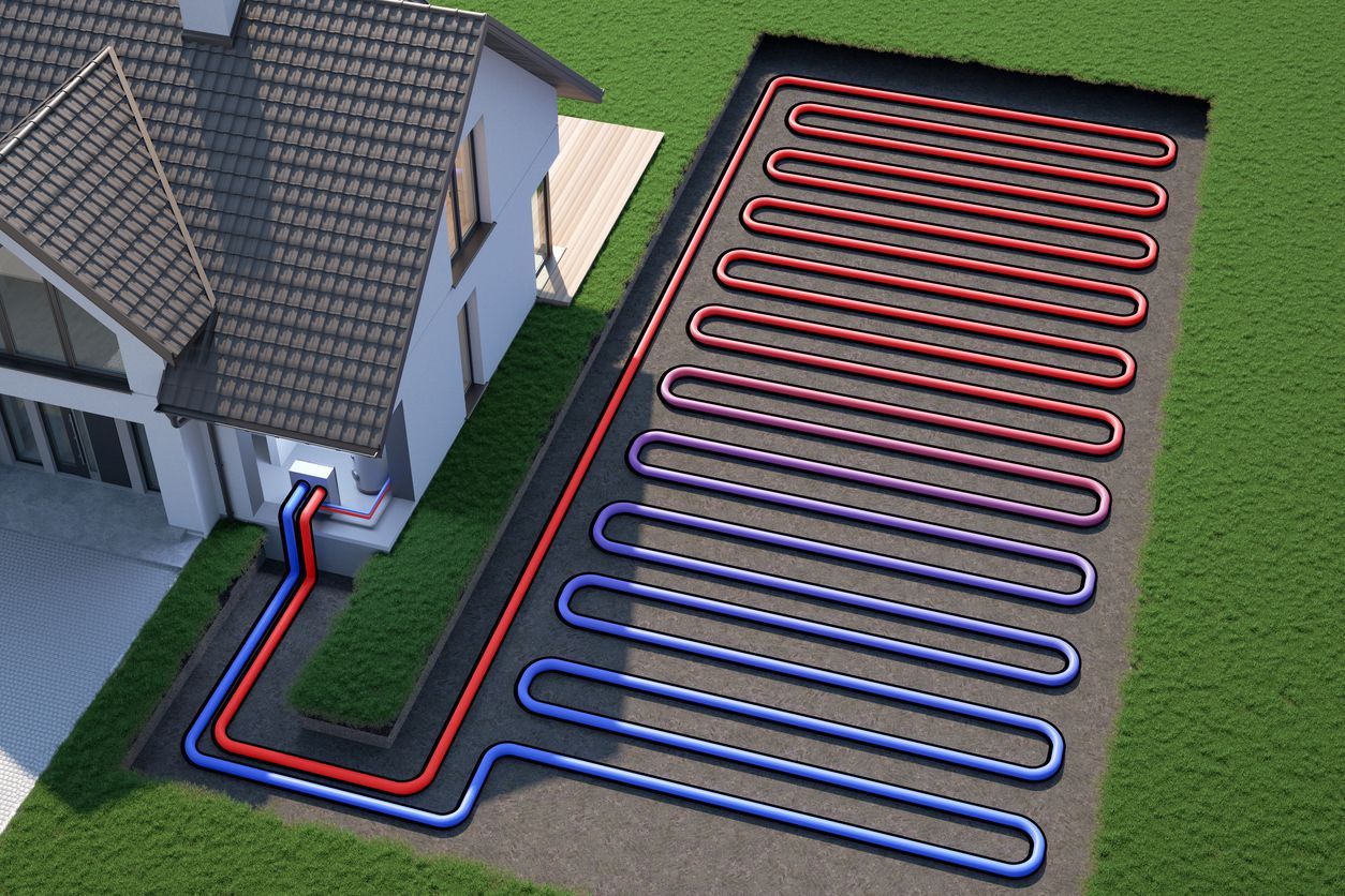 House with underground heating pipes laid in red and blue loops across a lawn.