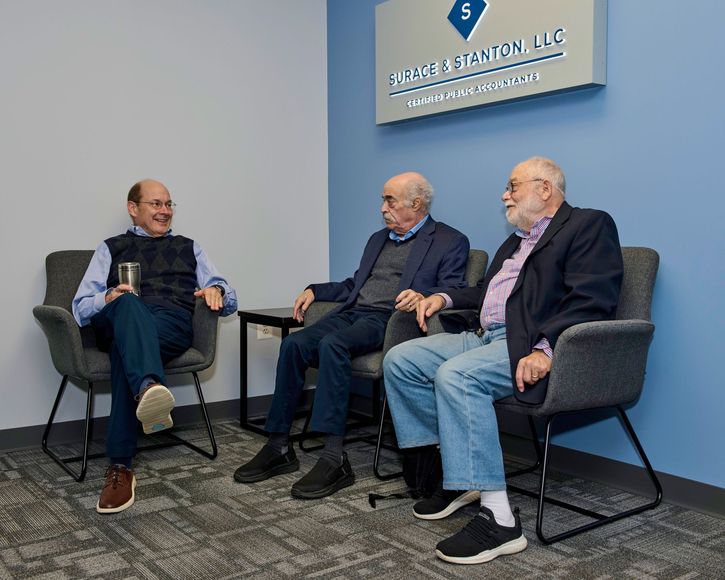 A man and a woman are walking down stairs in a park.