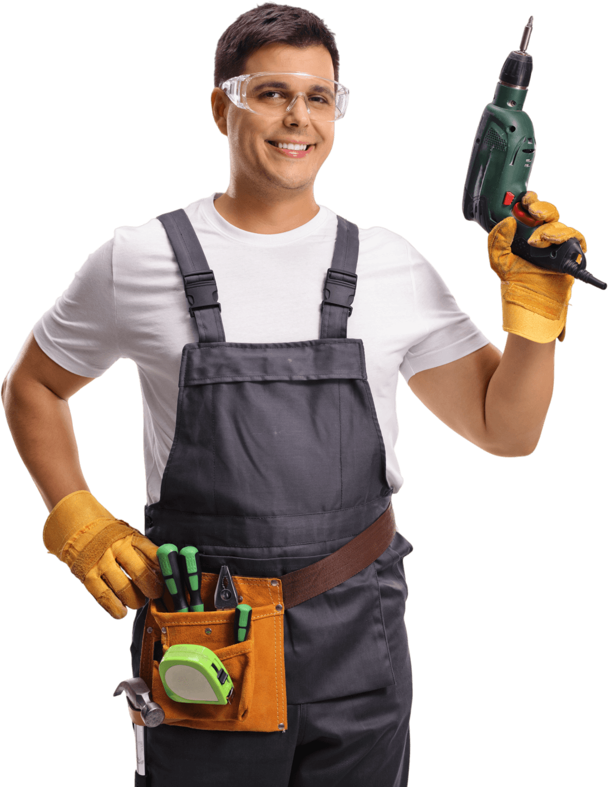 Person in gray overalls holding a drill and wearing safety goggles and gloves.