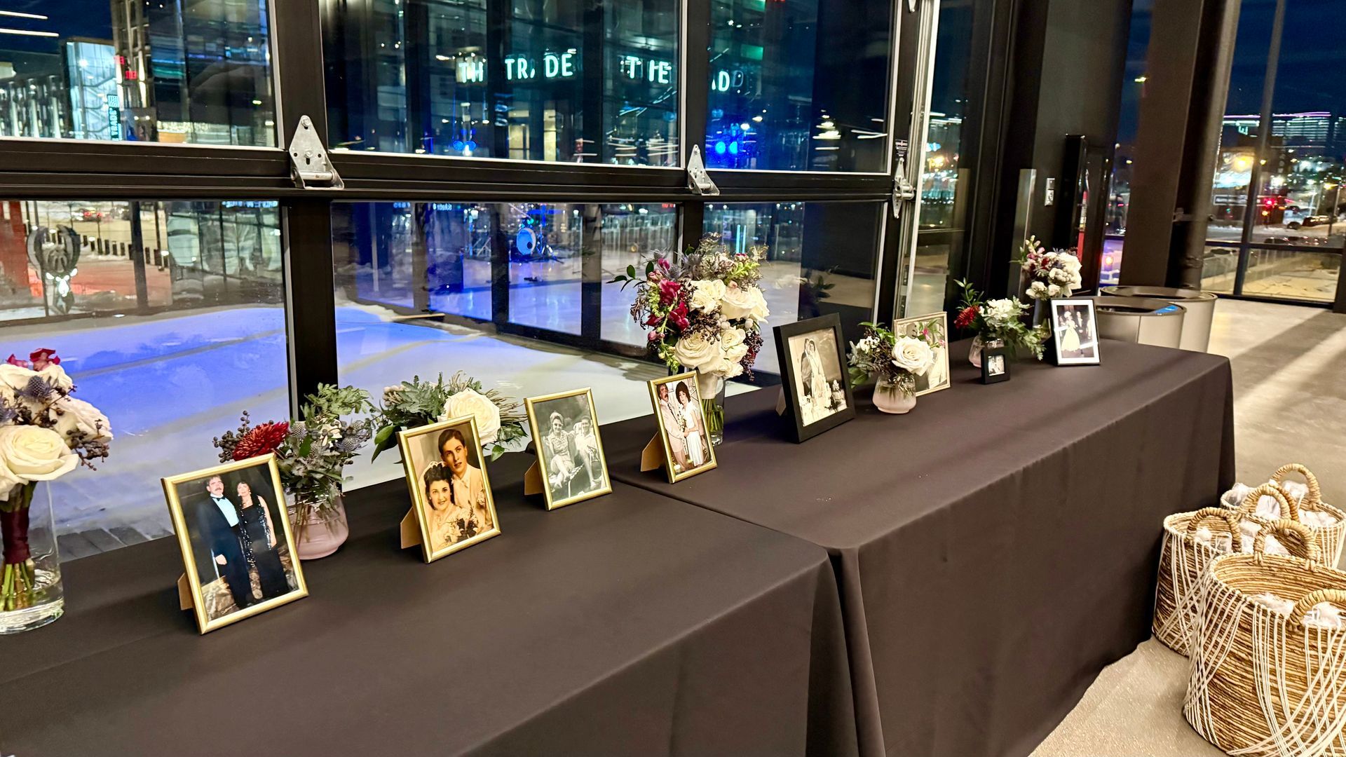 Table with framed photos and flowers, set against a city night view.
With Love, Wedding management, Milwaukee Wedding Coordinator