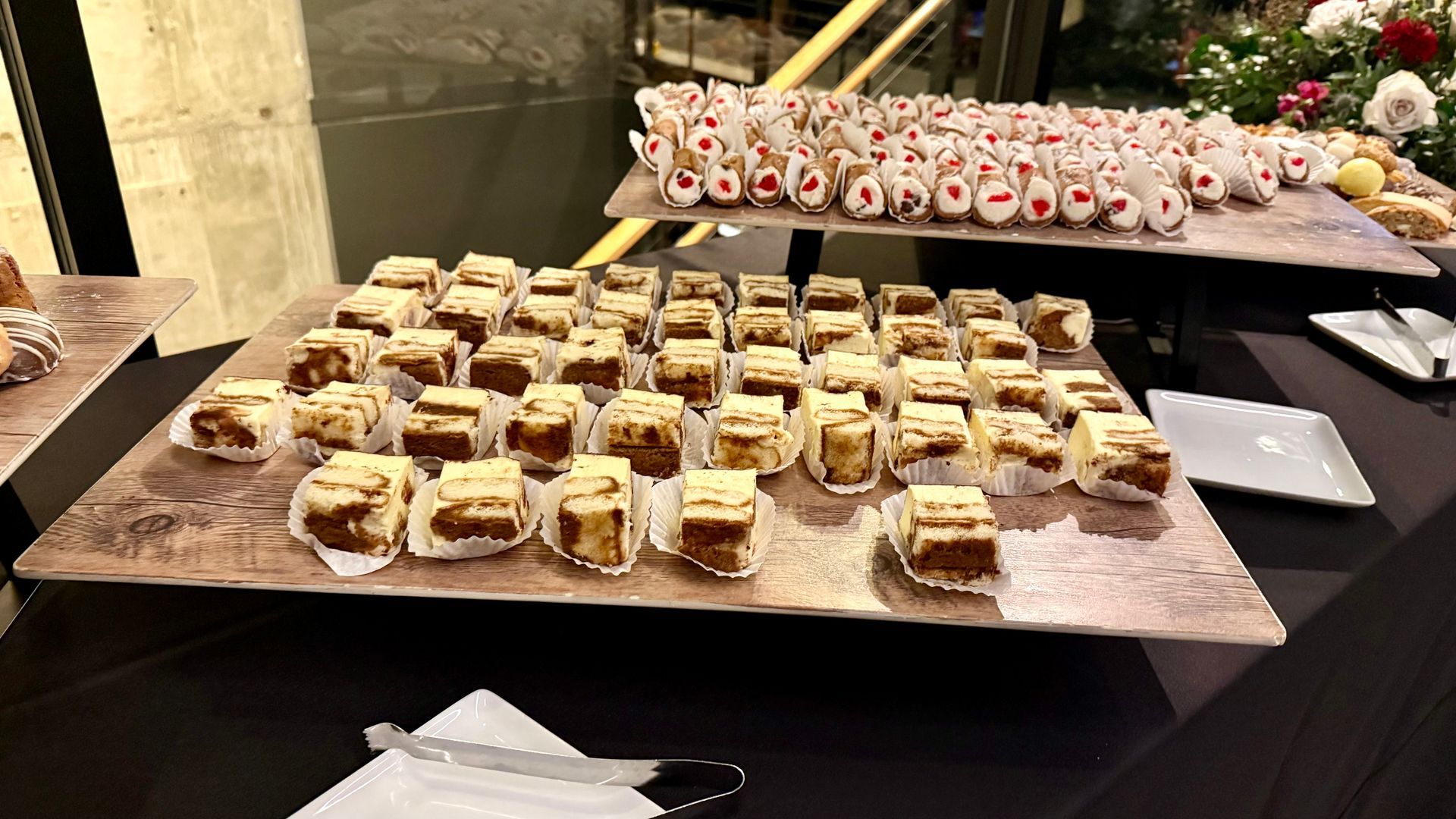 Dessert table with trays of mini cakes and treats.
With Love, Wedding management, Milwaukee Wedding Coordinator