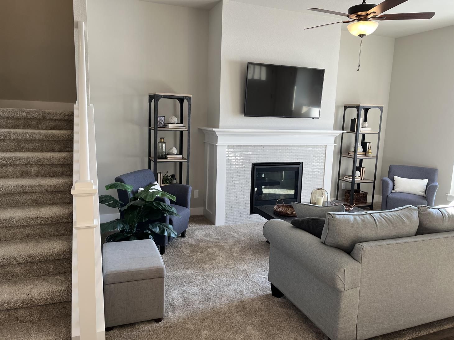 A man is painting a wall with a brush.