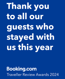 A blue sign that says `` thank you to all our guests who stayed with us this year ''