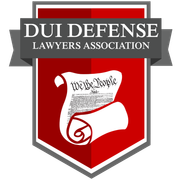 The logo for the dui defense lawyers association has a scroll of the constitution on it.