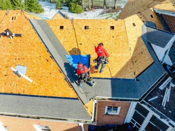 roofers replacing an old roof