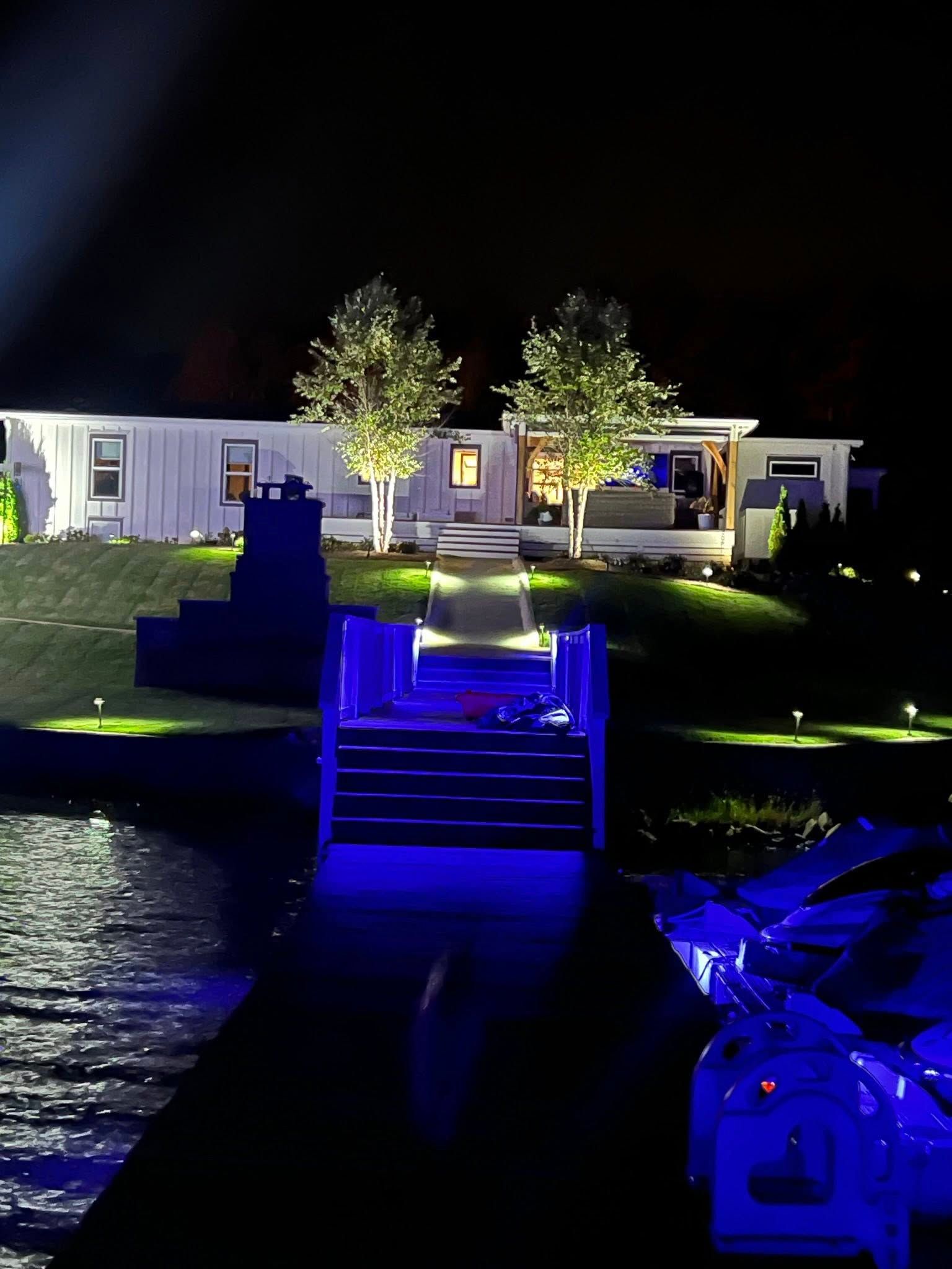 A house is lit up at night with blue lights