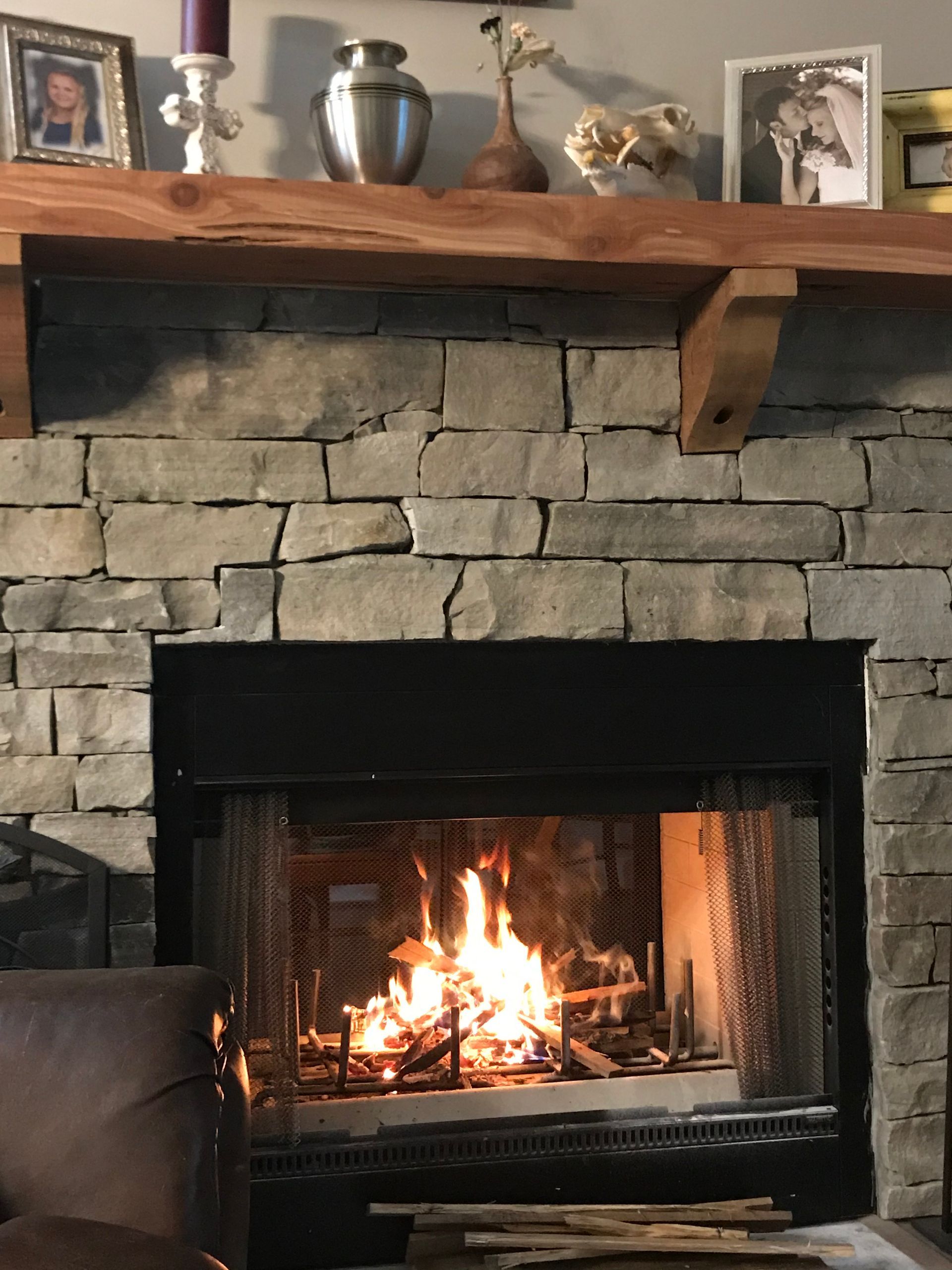 A rock wall is being built in a backyard.