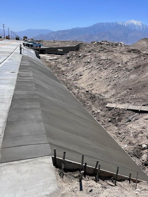 A concrete walkway is being built in the desert