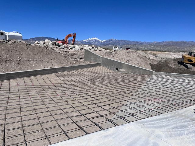 A construction site with a bulldozer in the background