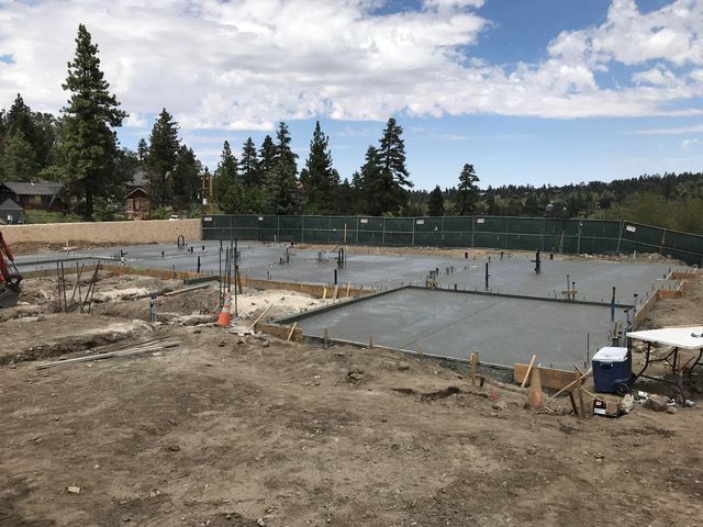 A construction site with a table and a cooler in the middle of it