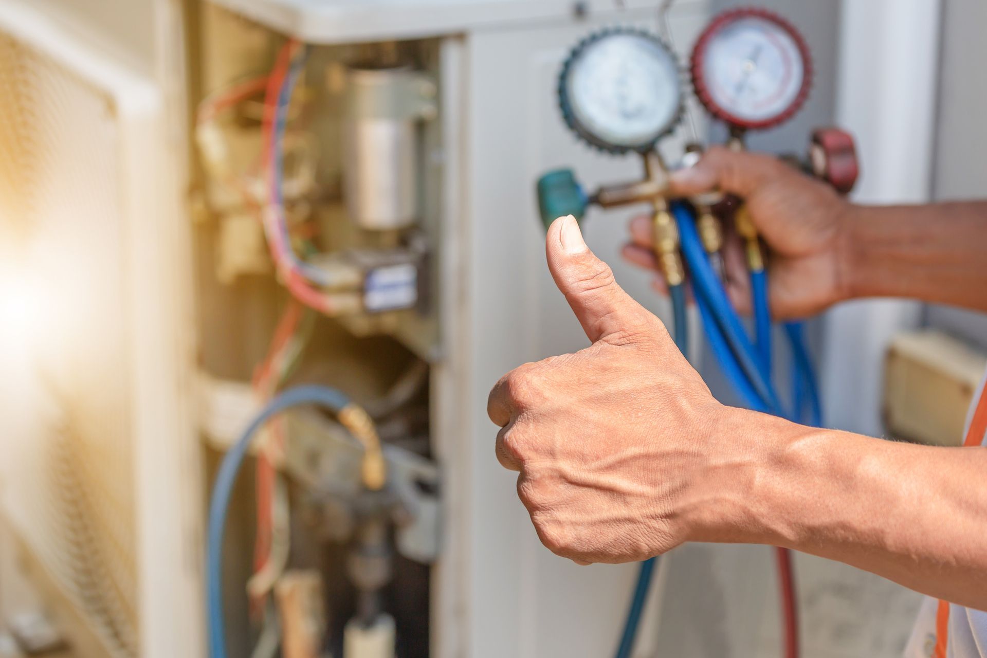 Woman controlling home temperature with electronic thermostat in Sanford.