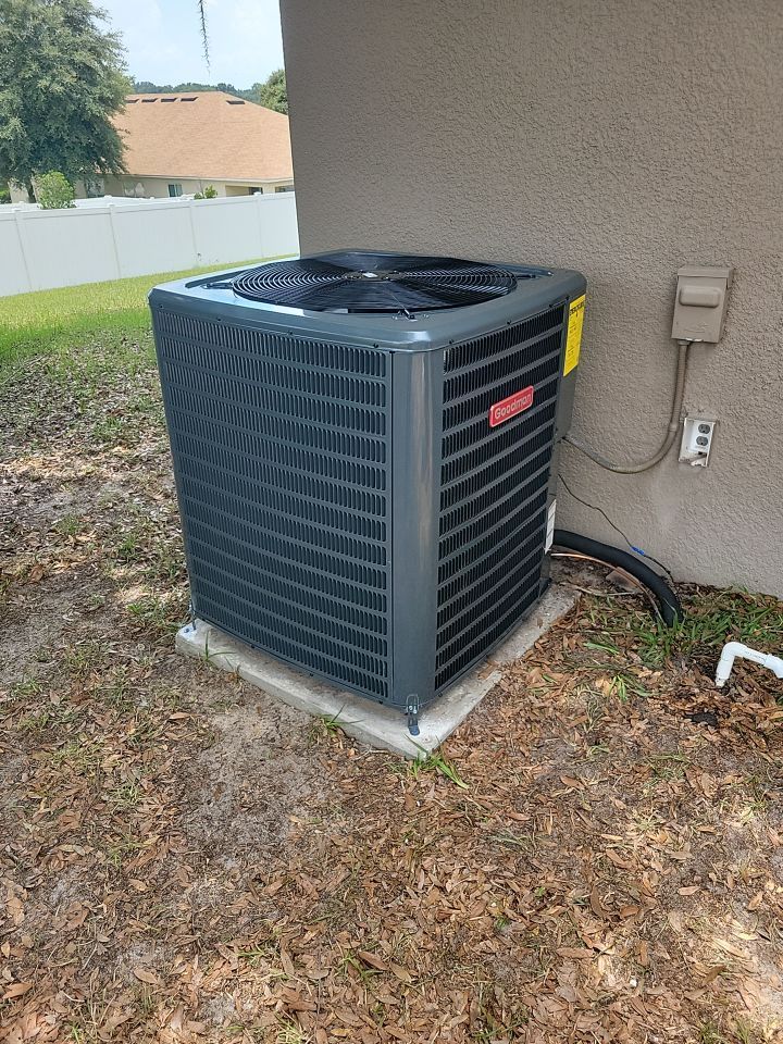 Heat pump installation outside of home by Air Rescue.