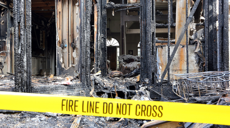 Fire damaged house with a fire line for fire restoration. 