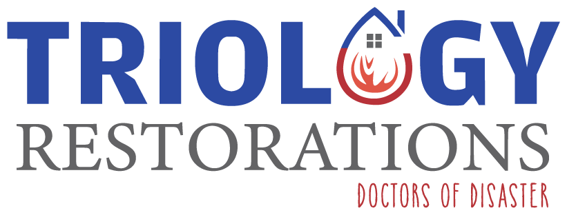 The logo for triology restorations is blue and red with a house on it.