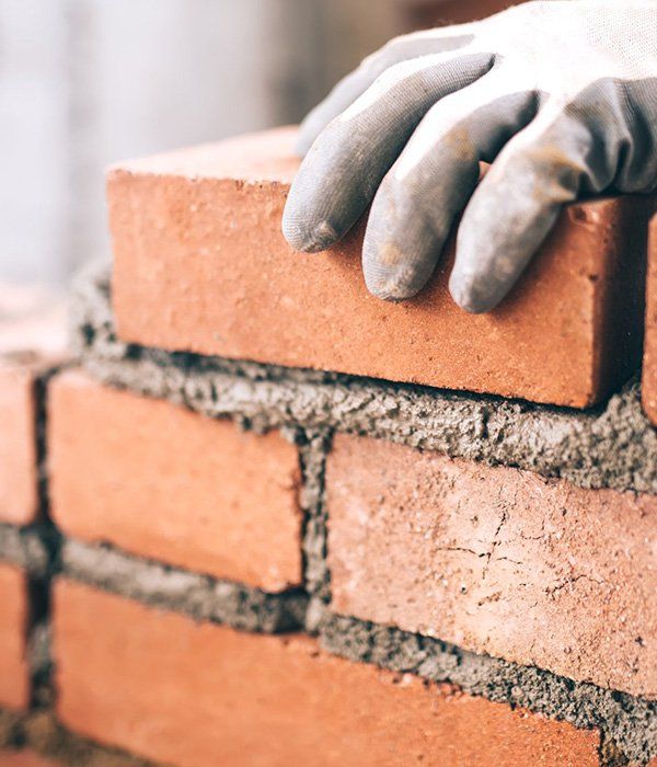 Bricklayer Installing Bricks — Bricklayers in Yeppoon, QLD