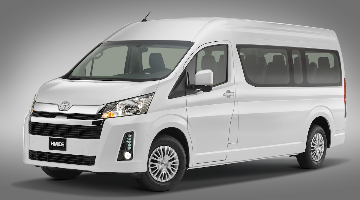 A white van is parked on a gray background.