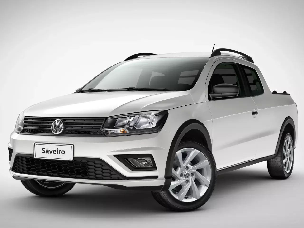 A white volkswagen saveiro truck is sitting on a white surface.