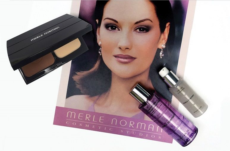 Merle Norman cosmetic products and a woman's portrait on a flyer.