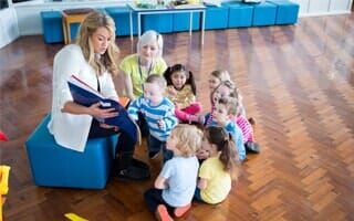 Woman teaching kids — Daycare in Rahway, NJ