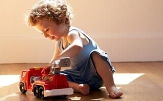 Boy playing with red toy car — Kindergarten in Rahway, NJ