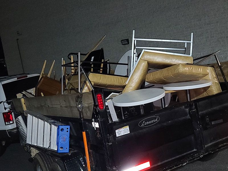 Trailer full of restaurant furniture, commercial cleanouts