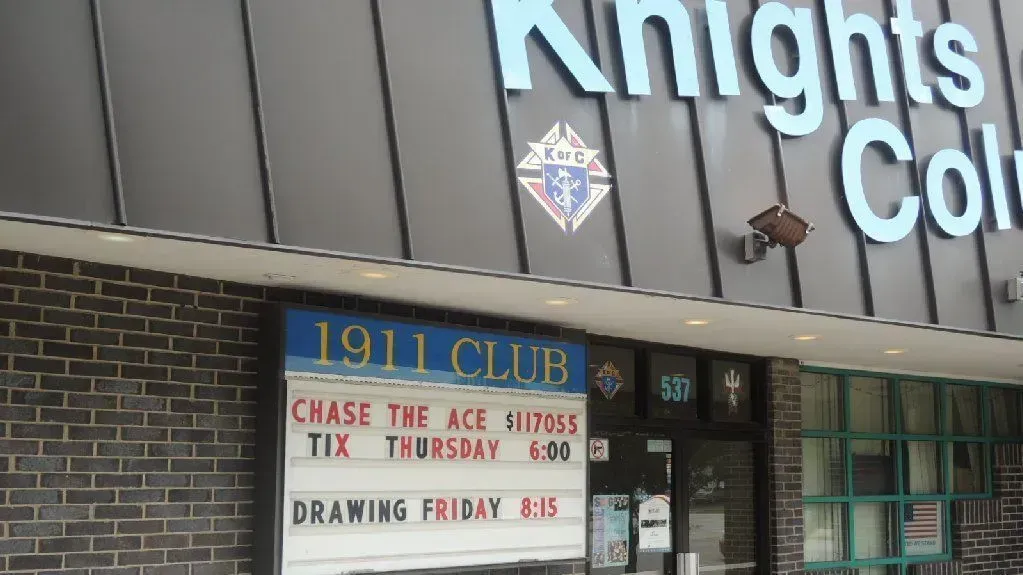 A sign on the side of a building that says 1911 club