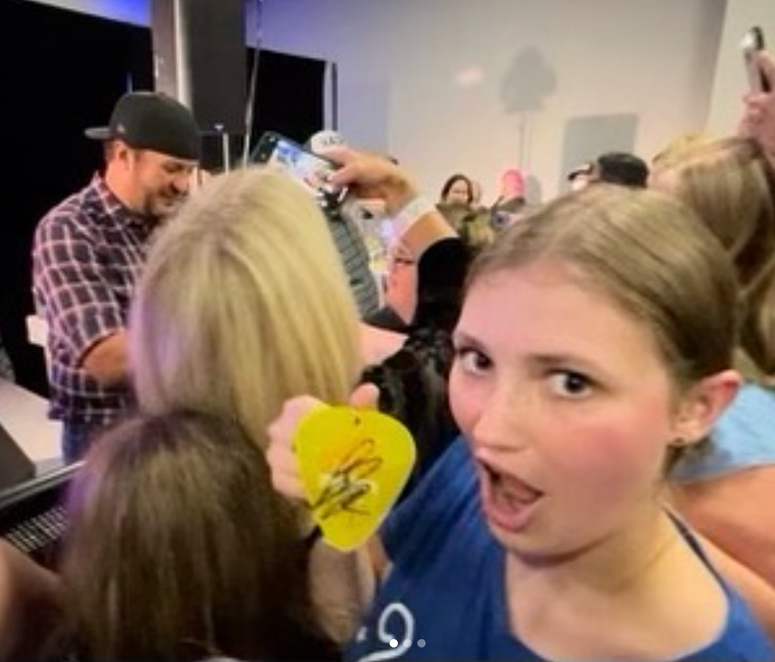 A girl in a blue shirt with the number 2 on it