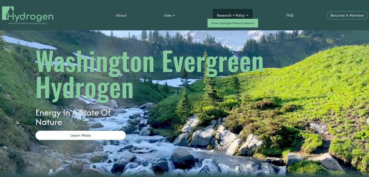 Website header for Washington Evergreen Hydrogen featuring a scenic mountain landscape with a flowing river and forest.