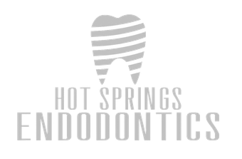 Logo for Hot Springs Endodontics, featuring a stylized blue tooth and text in blue.