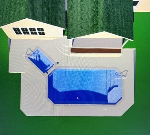 Top-down view of a house with a pool and spa. The pool and spa are blue. Green roof, light concrete patio.