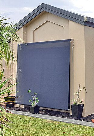 Shed With a Blue Awning on the Side of It — Tropical Shade Blinds in Brinsmead, QLD