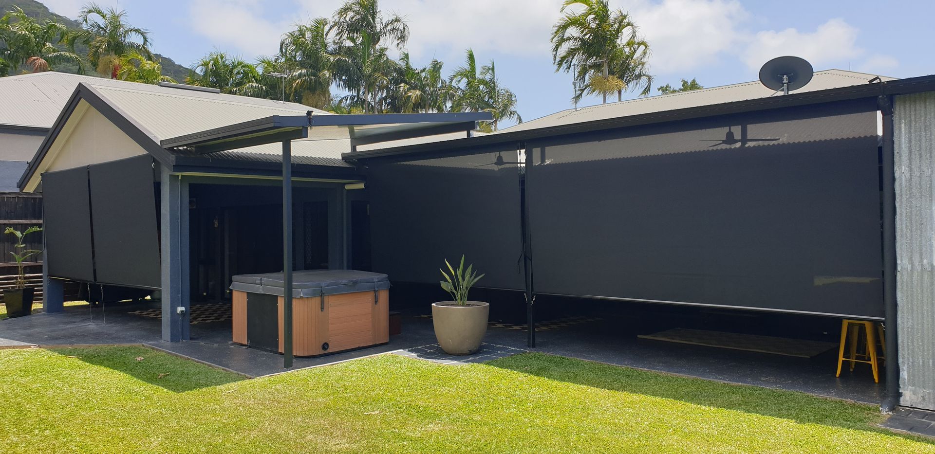 Truck is Parked in Front of a Large Window on a Wooden Deck — Tropical Shade Blinds in Brinsmead, QLD
