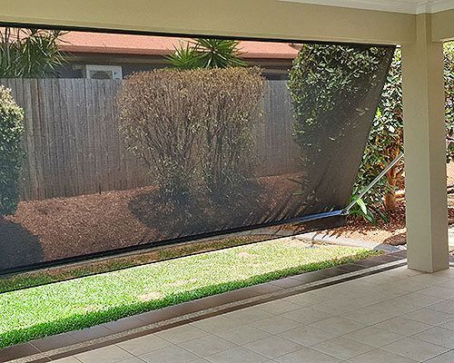There is a Fence in the Background — Tropical Shade Blinds in Brinsmead, QLD