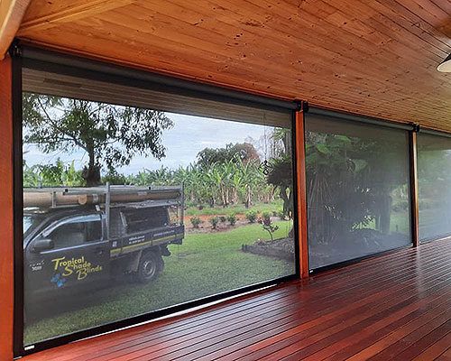 Truck is Parked in Front of a Large Window on a Deck — Tropical Shade Blinds in Brinsmead, QLD