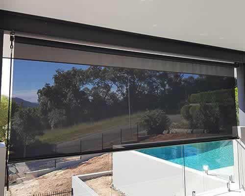 Large Window With a Swimming Pool — Tropical Shade Blinds in Brinsmead, QLD