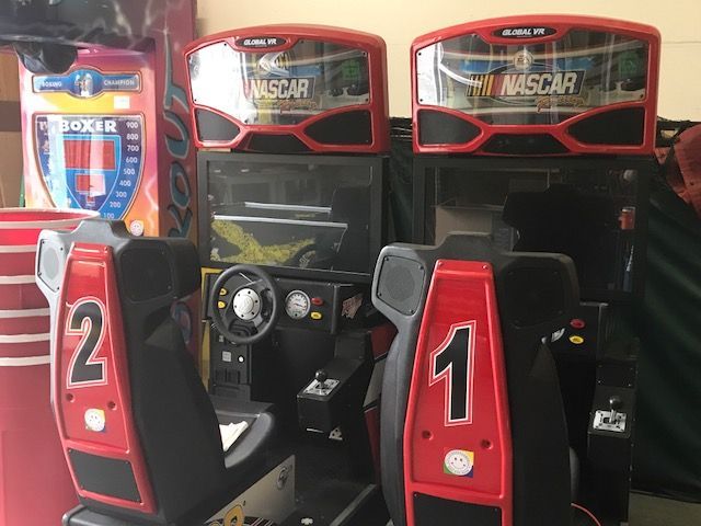 Arcade games for a sports game room. Pin Ball, car racing, Pool, Air Hockey, Foosball, and Axe throwing. 