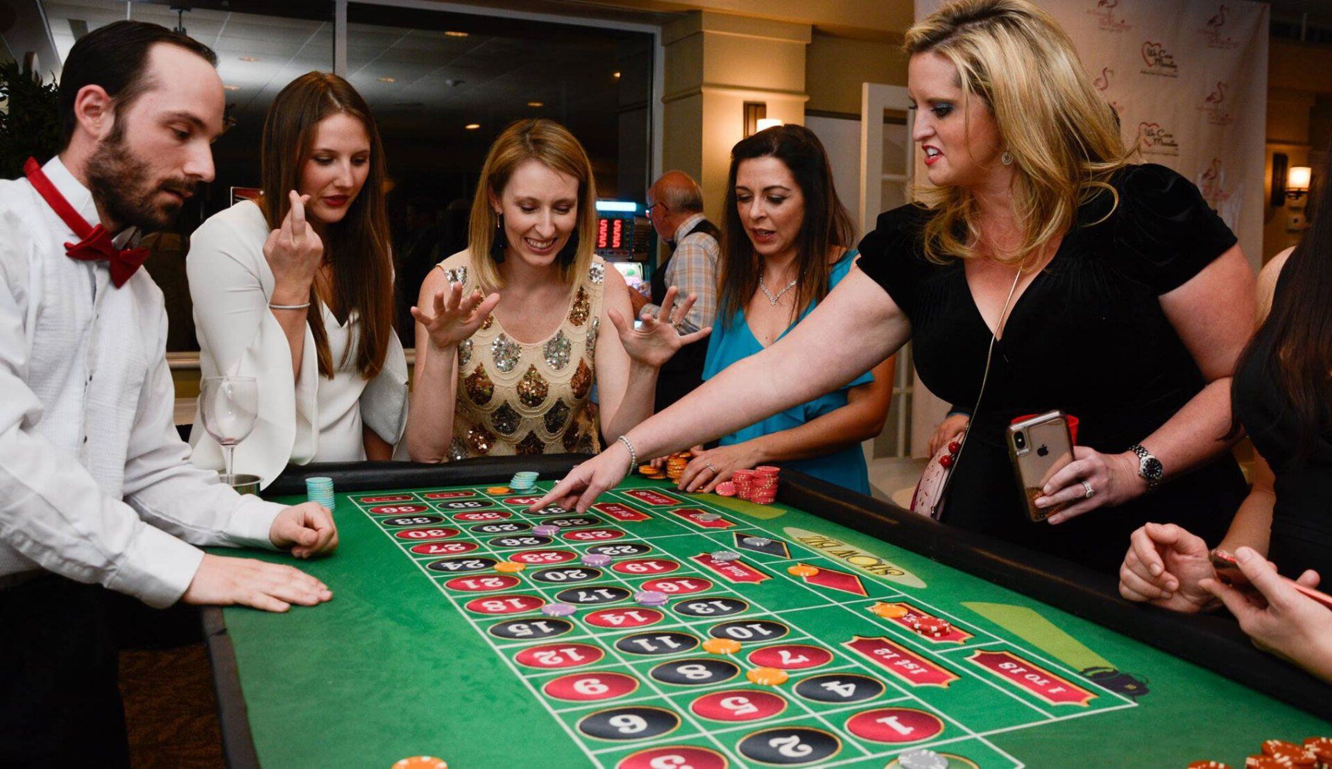 Guests picking the winning number at roulette. 