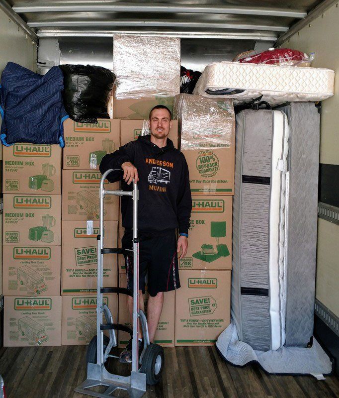 Boxes Behind A Man — Eau Claire, WI — Anderson Moving